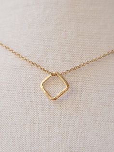 ESSENTIAL ELEGANCE A simple and small square is the main figure of this fine 24-karat gold-plated silver necklace with 3 microns thickness. LESS IS MORE In a world overloaded with stimuli, it is essential to reduce the superfluous and focus on what really matters. If you agree that less is more... This pendant is for you. CARE IN EVERY DETAIL Our pieces are made with great care and dedication, paying special attention to ensuring that the production process from the original design to the final Square Pendant Necklace, Small Necklace, Square Necklace, Triangle Pendant, Square Pendant, Minimalist Necklace, Necklace Handmade, Gold Plated Silver, Production Process