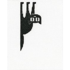 a cross stitch pattern with a black and white image of a cat hanging upside down