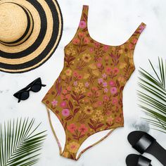 This Boho Women's Floral One-Piece Swimsuit for all figures will bring out your best features. Enjoy the smooth fabric and the flattering design, and show it off by the sea or pool! * 82% Polyester, 18% Spandex * Chlorine-resistant fabric * Cheeky fit with a scoop neckline and a low scoop back * Zig-zag stitching * Double-layer front  * Four-way stretch material stretches and recovers on the cross and lengthwise grains This product is made especially for you as soon as you place an order, which Tropical Floral Print Bodysuit For Beach, Green Floral Print Bodysuit For Beach, Beachwear Bodysuit With Floral Print For Pool, Fitted Tropical One-piece Swimsuit For Sunbathing, Beachwear Floral Print Bodysuit For Pool, Floral Print Beachwear Bodysuit For Beach, Tropical Fitted One Piece For Sunbathing, Tropical Sleeveless One-piece For Sunbathing, Fitted Tropical One-piece For Sunbathing