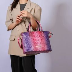 Introducing our exquisite Frankie Satchel Bag, a fusion of bold style and practical design. This Satchel is crafted from luxurious faux gradient rainbow crocodile-embossed material, offering a vibrant and unique texture that adds a striking touch to any ensemble. The bag features a secure top zipper closure, ensuring your belongings stay safe and easily accessible. Inside, you will find a thoughtfully organized space with two slip pockets ideal for your phone and small accessories and a wall zip Luxury Multicolor Shoulder Bag With Removable Pouch, Elegant Multicolor Shoulder Bag With Double Handle, Formal Multicolor Shoulder Bag With Removable Pouch, Luxury Multicolor Handheld Shoulder Bag, Elegant Multicolor Double Handle Shoulder Bag, Woven Tote Bag, Coral Turquoise, Satchel Handbags, Satchel Bag