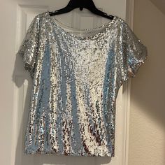 Silver Sequin Scoop Neck Top. Dress Up Any Outfit For The Holidays Silver V-neck Top For Party Season, Silver V-neck Top For Night Out, Cheap Silver V-neck Top, Cheap Sequined Crew Neck T-shirt, Cheap Cotton Sequined T-shirt, Boho Peasant Top, Bohemian Tunics, Linen Tunic Tops, Black Floral Top