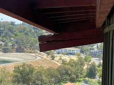 a view from the porch of a house overlooking a lake