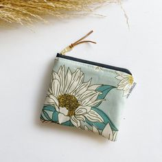 "Stash your odds and ends with this adorable square mini zipped pouch! As beautiful as it is functional, these bags are perfect for travel or everyday use! A mini first aid kit, a manicure set, jewelry holder or small makeup bag - it can be used for any organizational purpose!  Buy it for yourself or as a thoughtful gift to a friend or a family member! Makes a great gift paired with a gift card holder.  Specs: Approx 5\"x4\" Metall ykk zipper  Zipper is accented with a leather pull tag Lined wit Blue Zipper Coin Purse As Gift, Green Zipper Pouch Coin Purse As Gift, Green Rectangular Coin Purse For Everyday Use, Handmade Blue Cosmetic Bag For Gift, Cute Blue Rectangular Coin Purse, Blue Coin Purse With Zipper Closure As Gift, Cute Rectangular Coin Purse With Zipper, Green Coin Purse With Zipper Closure As Gift, Green Coin Purse With Zipper As Gift