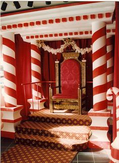 an elaborately decorated room with red and white striped walls