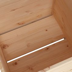 the inside of a wooden box is shown