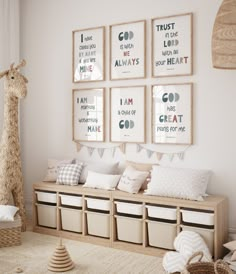 a nursery room with posters on the wall and stuffed giraffe