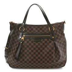 This is an authentic LOUIS VUITTON Damier Ebene Evora GM. The bag has a distinctive structure and is featured in Louis Vuitton damier patterned canvas. There is complimentary signature ebene brown cowhide leather trim and sturdy leather strap top handles with the option to attach an adjustable shoulder strap. The top zipper opens to a rouge red fabric interior with patch pockets. This spacious bag has both luxury and style, from Louis Vuitton! Brown Cowhide, Louis Vuitton Damier Ebene, Damier Ebene, Strap Top, Strap Tops, Red Fabric, Authentic Louis Vuitton, Leather Trim, Cowhide Leather