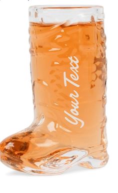 a glass boot shaped like a shoe with the word love on it's side