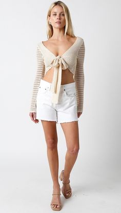 Time to bask and the sun and do it in the Sweet and Salty Natural Crochet Crop Top! Natural crochet fabric shapes this V-neck top with a front-tie and long, wide bell sleeves. Features a cropped bodice. Style with jean shorts and sandals for an elevated summer look! DETAILS & FIT Relaxed Fit. 100% Acrylic. Machine wash cold. Imported. Chic Long Sleeve Crochet Top For Beach, Beige V-neck Crop Top For The Beach, Chic Open Knit Crop Top For Summer, Chic Summer Open Knit Crop Top, Beige Cropped Crochet Top For Beach, Spring Beige Open Knit Crop Top, V-neck Crop Top For Beach Season, Long Sleeve Crop Top For Beach Vacation, Beige Open Knit Crop Top For Spring