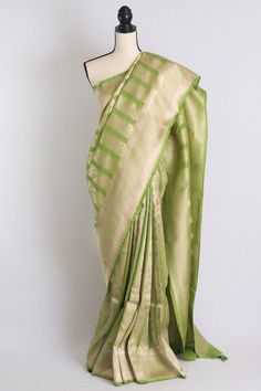 Pure Katan Brocade Banarasi Saree with Zari in Green and Brushed Gold. The saree is fall pico done ready to wear. It DOES come with an unstitched blouse piece that is cut and separated from the saree. Note: Product color may slightly vary due to photographic lighting sources or your device settings. Handwoven articles might have minor irregularities in the embroidery/weave/Dye that are not to be considered defective. Kota Sarees, Gold Blouse, Banarasi Saree, Banarasi Sarees, Blouse Piece, Green And Gold, Antique Gold, Halter Dress, Color Variations