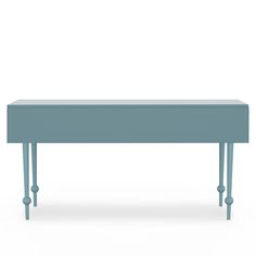 a blue bench sitting on top of a white floor next to a wooden table with two legs