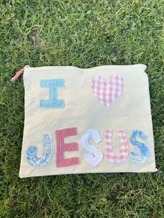 a small bag with i love jesus written on it