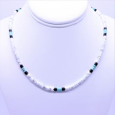 "This Native American inspired beaded heishi necklace is made with natural white buffalo turquoise from Nevada, blue green turquoise, black onyx, and sterling silver spacer beads. The beads are uniform in size, making for a clean flowing pattern of semi precious gemstones. The AAA grade white buffalo turquoise beads are beautiful shades of gray and white polished to a fine quality semi gloss luster that compliments that of the green turquoise and black onyx. White Buffalo Turquoise This rare whi Beaded Necklace Native, Flowing Pattern, Silver Beaded Necklace, Heishi Necklace, White Buffalo Turquoise, Necklace Extender, Boho Choker, Turquoise Bead Necklaces, Silver Bead Necklace