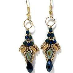 "The beautiful blue and gold dangle earrings, fit for casual outfits and evening occasions.  They upgrade any outfit. These statement earrings are chic and fun and perfect as a gift to yourself or to someone you love.    The blue and gold dangle drop earrings are beaded with Czech beads and Miyuki seed beads. The earrings are attached to a gold-plated brass fishhook. ♦ 𝗨𝗽𝗴𝗿𝗮𝗱𝗲 𝘆𝗼𝘂𝗿 𝗷𝗲𝘄𝗲𝗹𝗿𝘆 𝗰𝗼𝗹𝗹𝗲𝗰𝘁𝗶𝗼𝗻 𝘄𝗶𝘁𝗵 𝘁𝗵𝗶𝘀 𝗯𝗲𝗮𝘂𝘁𝗶𝗳𝘂𝗹 𝗲𝗮𝗿𝗿𝗶𝗻𝗴𝘀 ♦ ♦ 𝗧𝗵𝗼𝘂𝗴𝗵𝘁𝗳𝘂𝗹𝗹𝘆 𝗽𝗮𝗰𝗸𝗮𝗴𝗲𝗱 𝗶𝗻 𝗮 𝗴𝗶𝗳𝘁 𝗯𝗼𝘅 ♦ ✧ 𝗠𝗘𝗔𝗦𝗨𝗥𝗘𝗠𝗘𝗡𝗧𝗦 ✧ Total length: 2.56\" (6.5 cm) Width: 0.63'' (1.6 cm) For more dangle earrings click here: https://www.etsy.com/shop/liorajewelry?ref=seller-platform-mcnav§ion_id=19059124 For more jewelry designs visit my shop: ht Blue Earrings With Gold Beads, Blue Gold Beaded Drop Earrings, Gold Beaded Drop Earrings, Elegant Handmade Blue Linear Earrings, Elegant Blue Crystal Earrings With Dangling Beads, Elegant Blue Beaded Earrings For Party, Elegant Handmade Blue Chandelier Earrings, Boho Beaded Earrings, Blue And White Earrings