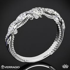 a white gold wedding ring with diamonds on the side and an advertise for it