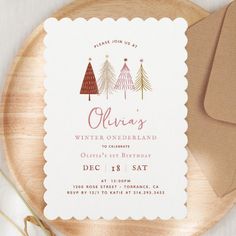 a wooden plate topped with a card and envelope