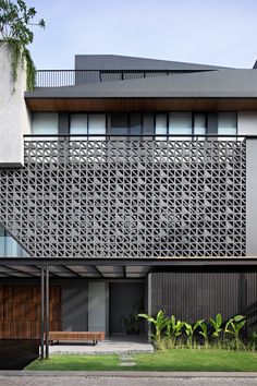 a modern house with an intricate design on the side