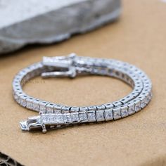 Sparkling Cubic Zircon Bracelet, 925 Sterling Silver Bracelet, Zirconia Silver Bracelet, Tennis Silver Bracelet, New Year Gift's  ✦ ✦  METAL DETAILS✦ ✦ ✦ Metal : 925 Sterling Silver ✦ Bracelet Total Weight : 9.34 Gram  ✦ Bracelet Size : 7.5 Inch  ✦ ✦ CUSTOMISATION DETAILS✦ ✦  We can customize any piece of fine jewelry. You can simply message us on Etsy or drop a text at +91-7357229656 (WhatsApp/I Message) to let us know about all the customization you want. Customization can include : ✦ The Gemstone: This Bracelet  can be made in Emerald, Ethiopian Opal, Rainbow Moonstone, Sapphires, Citrine, Ruby, Tanzanite, Diamond, Kyanite, Garnet, Tourmaline, and any gemstone you would like! ✦ Size and Shape: We can totally change the size of the gemstone (Bigger/Middle/Smaller) and shape too (Emerald Silver Cubic Zirconia Bracelet As Gift, Cubic Zirconia Sterling Silver Bangle Bracelet Gift, Silver Fine Jewelry Tennis Bracelet Gift, Silver Tennis Bracelet As Gift, Fine Jewelry Style, Silver Sterling Silver Tennis Bracelet Gift, Silver Sterling Tennis Bracelet As Gift, Silver Sterling Tennis Bracelet For Gift, Silver Jubilee Tennis Bracelet As Gift, Zircon Bracelet