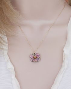 "Description This sweet little pendant necklace features a rare vintage enamel pink confetti pansy flower trimmed with a gold finish. . Great gift for the flower lover in your life or treat yourself to a lovely pansy pendant Hangs from a fine 14 karat gold filled chain. The Pansy is 1 \" wide, vintage elements are in excellent condition. ** The last photo shows a different pansy with the soaring bird charm, this pansy is the same size as the pink one Spring closure clasp Photoed with a 16\" chai Pink Enamel Jewelry With Flower Charm, Pink Vintage Charm Pendant Jewelry, Charming Flower Pendant Jewelry, Charming Flower Pendant Jewelry With Charm, Dainty Vintage Charm Flower Pendant Jewelry, Pink Enamel Dainty Jewelry, Dainty Flower Pendant Jewelry With Vintage Charm, Dainty Jewelry With Vintage Charm And Flower Pendant, Dainty Flower Pendant With Vintage Charm