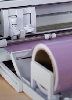 a close up of a machine that is cutting paper