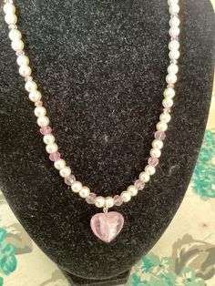 Lovely summer necklace made from 6mm ivory glass beads with a few pink crystals set in at the front and a pink heart glass pendant Length 18 inches Has rhinestone magnetic clasp for easy and secure fastening Supplied in gift box Pink Pearl Jewelry With Heart Charm, Pink Heart-shaped Pearl Necklace, Elegant Pink Heart-shaped Beaded Necklaces, Heart-shaped Pink Pearl Necklace, Elegant Pink Heart-shaped Beaded Necklace, Pink Heart Pendant, Summer Necklace, Magnetic Clasp, Pink Crystal