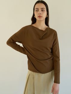 Editor's notesA knit top featuring a cowl neck, long sleeves, and this draped cowl neck is both elegant and alluring.- Soft-touch draped knit top- Loose silhouette- Rib-knit only on back hem- Long sleeve- Lightweight fabricMeasurements(in.)- Size: One size(XS-M)- Shoulder: 16.93in- Chest: 18.50in- Sleeve length: 23.62in- Sleeve Width: 5.91in- Model size: 5' 6 / Bust: 31.5in / Waist: 23.5in / Hip: 34in Composition & Care- 70% Rayon, 30% Polyester- Dry clean onlyDesigner- by MOHAN Chic Cowl Neck Top, Elegant Draped Tops For Layering, Elegant Asymmetrical Tops For Fall, Draped Tops For Workwear In Fall, Draped Fall Tops For Workwear, Fall Layering Tops With Cowl Neck, Spring Workwear Tops With Cowl Neck, Versatile Cowl Neck Top For Spring, Chic Foldover Top Blouse For Fall