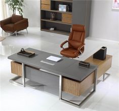 an office desk with two chairs and a book shelf