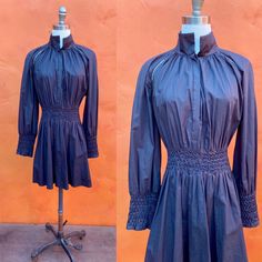 Witchy black dress smocked waist and sleeve cuffs high neck (could fold down as well) fit/flare side zipper feels like cotton or cotton blend EUC XL - 2XL Bust: 52" Waist: 36-40" Hip: 62" Shoulder to hem: 33=4" INSTAGRAM: @macabreatheart Dark Cottagecore, Black Mini Dress, Smock Dress, Black Mini, Dress Clothes For Women, Fit & Flare, Mini Black Dress, Fit And Flare, Vintage Black