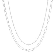 Sometimes, opposites really do attract! Case in point, this double-strand necklace makes one chic piece. It features a silver paperclip chain and a beaded station chain. Its high contrast works best with simpler tops and dresses. The piece comes with a “.925” sterling silver quality stamp as a symbol of guaranteed product quality. Made in Italy. Silver Formal Paperclip Chain Necklace, Elegant Silver Necklace With Paperclip Chain, Classic Paperclip Silver Chain Necklace, Elegant Silver Dual-tone Necklaces, Silver Double Chain Multi-strand Necklace, Contrast Words, Double Strand Necklace, Opposites Attract, Sterling Necklaces