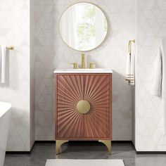 a bathroom with a sink, mirror and bathtub in white and gold decor on the walls