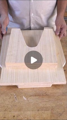 a person is making a wooden object with wood veneers on the bottom and sides