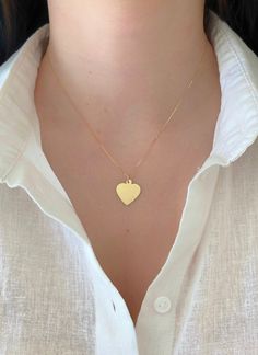 "Dainty And Elegant 14K Yellow Gold Heart Pendant Charm. This Minimalist Pendant Will Be A Great Addition To Any Other Jewelry Your Wear On Your Neck. Charm Is Sturdy And Solid And Comes With The Option Of A High Quality Box Chain That Feels Very Silky. A Beautiful Gift She Will Treasure Forever! Jewelry Comes In A Cute Gift Box Ready To Present. Model Is Wearing A 16\" Chain. -Chain Is Additional, Look At The Length Options - All Jewelry Is New And Inspected For Quality Assurance. -Jewelry Is C 14k Gold Everyday Heart Necklace, Everyday 14k Gold Heart Necklace, Yellow Gold Heart Necklace Stamped 14k, Heart Disc, Gold Heart Pendant, Minimalist Pendant, Cute Gift Boxes, Heart Pendant Gold, Forever Jewelry