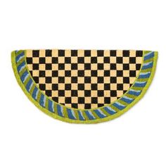 a black and white checkered area rug with green trim on the bottom, in front of a white background