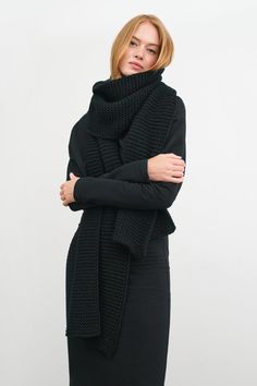 Knitted in our soft merino-blend toledo yarn, our Queens Scarf is a little sister to our ultra-oversized Bronx. Queens features the same cozy knit and texture at a scaled-down size—still more than generous enough to wrap yourself in for extra warmth.[SPLIT] Emmy, in black, is 5'10.5" (179 cm). Astrid, in olive, is 5'9" (175 cm) tall. Total length is approximately 82" (210 cm), or 6'10" long. Width is approximately 12" (31 cm). French Merino Wool Blend (20% Merino Wool, 80% Acrylic). Dry clean fo Black Oversized Scarf, Black Knit Scarf, Black Scarf Aesthetic, Black Crochet Scarf, Chunky Scarf Outfit, Scarf Aesthetic, Olive Coat, Chunky Crochet Scarf, Bulky Scarf