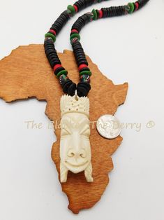 The African pendant is a beautiful bone carved piece. The hand carved African pendant is approximately 3 inches long with great detail. It is a thick piece. The necklace is beaded with a mix of African hand painted glass and wooden beads. The necklace closes with a large toggle clasp for easy access. If you have any questions please feel free to contact us at anytime. The piece will ship with insurance. Our products are not intended for babies or children as we use small pieces, wires and beads. Traditional White Carved Necklaces, Traditional Carved Adjustable Beaded Necklaces, Traditional Adjustable Carved Beaded Necklaces, Traditional Adjustable Carved Beaded Necklace, Pan African, Loc Jewelry, Bone Necklace, African Mask, African Masks