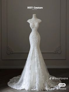 the back of a wedding dress on display in front of a white background with text that reads hey couture