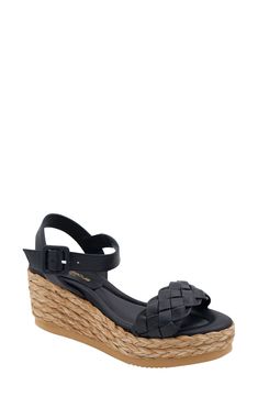 Woven leather straps add chic style to a vacation-ready sandal lifted by a jute-wrapped wedge heel. 2 3/4" heel; 1 1/2" platform Leather upper and lining/rubber sole Made in Spain Black Wedge Sandals With Woven Sole, Leather Wedge Sandals With Woven Detail, Black Wedge Sandals With 4-inch Heel For Summer, Modern Black Wedge Sandals With 4-inch Heel, Black Textured Sole Slip-on Wedge Sandals, Espadrilles Platform, Espadrille Wedge, Leather Espadrilles, Black Wedge Sandals