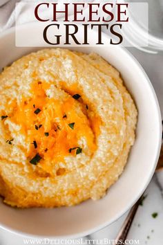 a bowl filled with cheese grits on top of a table