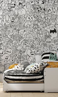 a bedroom with black and white wallpaper that has many cartoon characters all over it