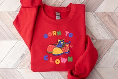 You were born to clown! Make a statement with this quirky clowncore & kidcore sweatshirt!  Perfect for those who want to keep it fun and avoid adulting, it's a fun and colorful addition to your wardrobe. Cozy, comfy, and sure to spark conversations!  Why you will love our sweatshirts  At Happy Gift Market, we pride ourselves on offering high-quality products that are both trendy and functional.  Each sweatshirt is individually printed and hand made just for you. Ethical and sweatshop free! We've Playful Red Cotton Sweatshirt, Playful Multicolor Sweatshirt For Streetwear, Playful Cotton Sweatshirt For Streetwear, Playful Crew Neck Sweatshirt For Streetwear, Funny Print Cotton Sweatshirt For Streetwear, Playful Cotton Sweatshirt With Graphic Print, Cotton Sweatshirt With Funny Print For Streetwear, Playful Cotton Sweatshirt With Funny Print, Fun Cotton Sweatshirt With Graphic Print