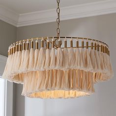 a chandelier hanging from a ceiling in a room