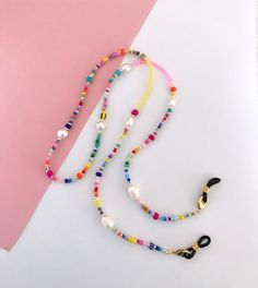 For more chains, please check out these listings: https://www.etsy.com/no-en/shop/Pearlsbymimmi?ref=simple-shop-header-name&listing_id=935334066&section_id=32595269 Delicate and colorful eyeglass and mask chain. I made it to look colorful and happy and allow you to wear your mask og glasses around your neck when not in use. Its also make a colorful long necklace. Silicone ends are adjustable to fit most glasses. Lobster claw attachments make it easy to replace silicone ends after too much wear & Spectacle Chain Diy, Sunglasses Beaded Chain, Beads Glasses Chain, Diy Glasses Chain, Glasses Chain Diy, Glasses Holder Necklace, Eye Glass Chain, Beaded Mask Chain, Beaded Glasses Chain