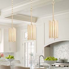 a kitchen filled with lots of counter top space and white cabinets next to an island