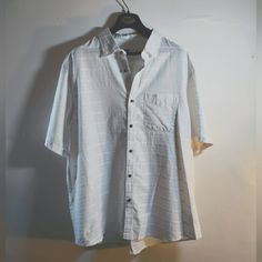 Causal Comfortable Button Up Button-up Short Sleeve Beach Shirt, Button-up Vacation Shirt, Casual Shirt With Buttoned Pockets And Casual Collar, White Short Sleeve Tops With Buttoned Pockets, Vacation Button-up Shirt, Classic White Shirt With Buttoned Pockets, Casual Summer Tops With Buttons, White Camp Shirt With Button Closure And Relaxed Fit, Summer Button-up Shirt With Buttoned Pockets