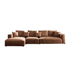 a large brown couch with pillows on it's back and side facing each other