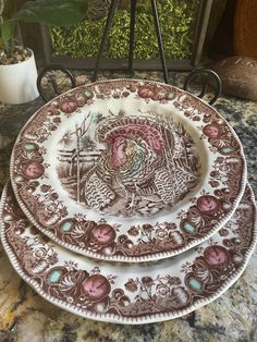 three brown and white plates sitting on top of a counter