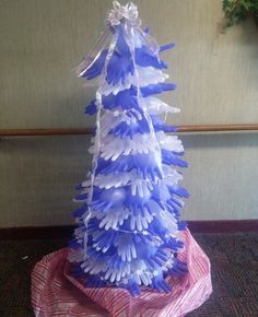 a blue and white christmas tree sitting on top of a table