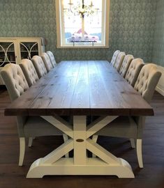 a large wooden table with chairs around it