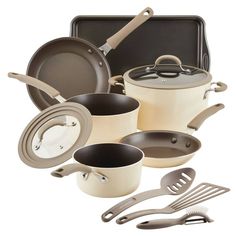 an assortment of pots and pans with utensils