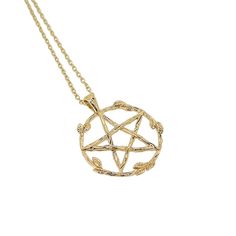 a gold necklace with an inverted design on it